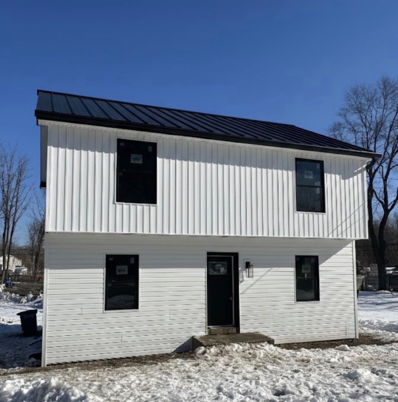 New siding & standing-seam metal roof — after