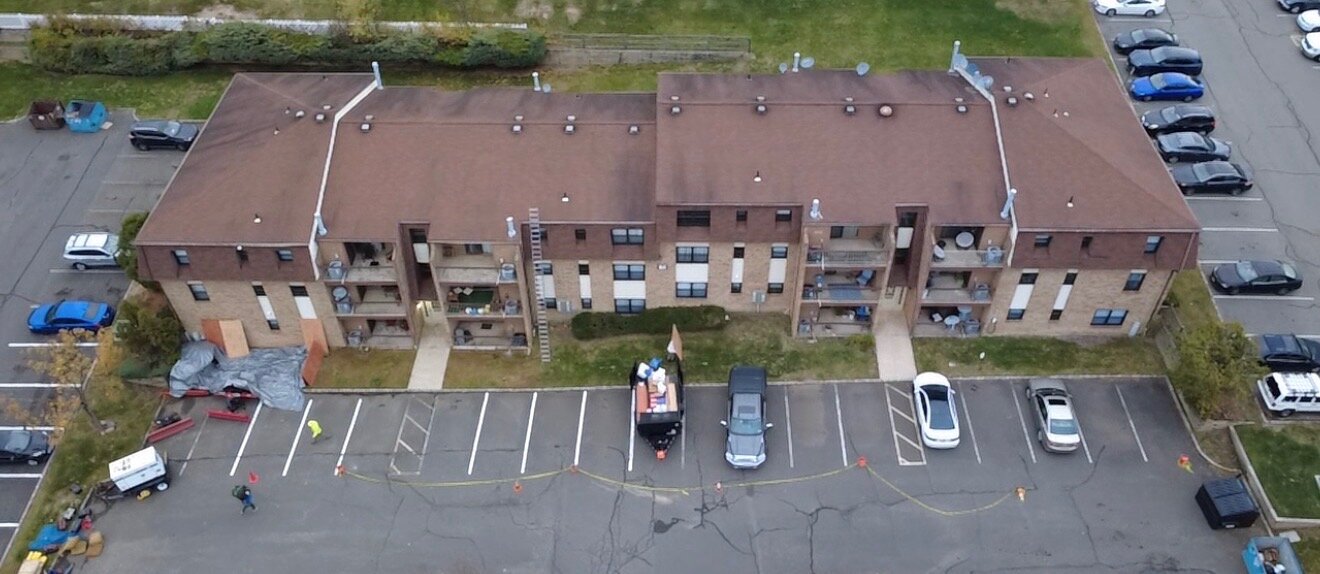 Multi-unit apartment reroof — before